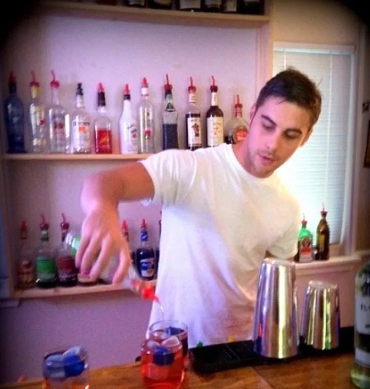 Bartending students practicing behind a real bar in Savannah